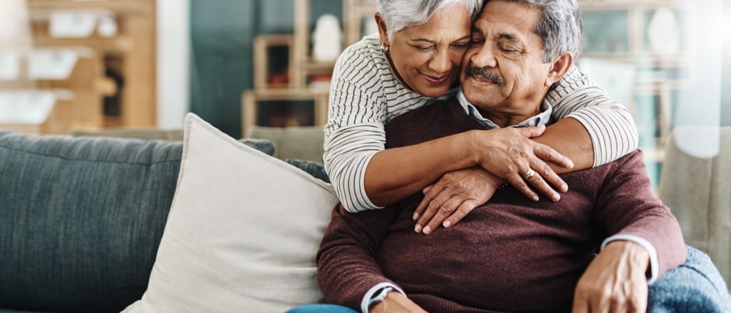 woman hugging a man on the sofa